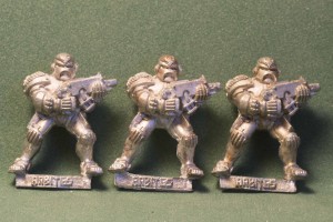 eBay picture of three Adeptus Arbites models with boltguns I won